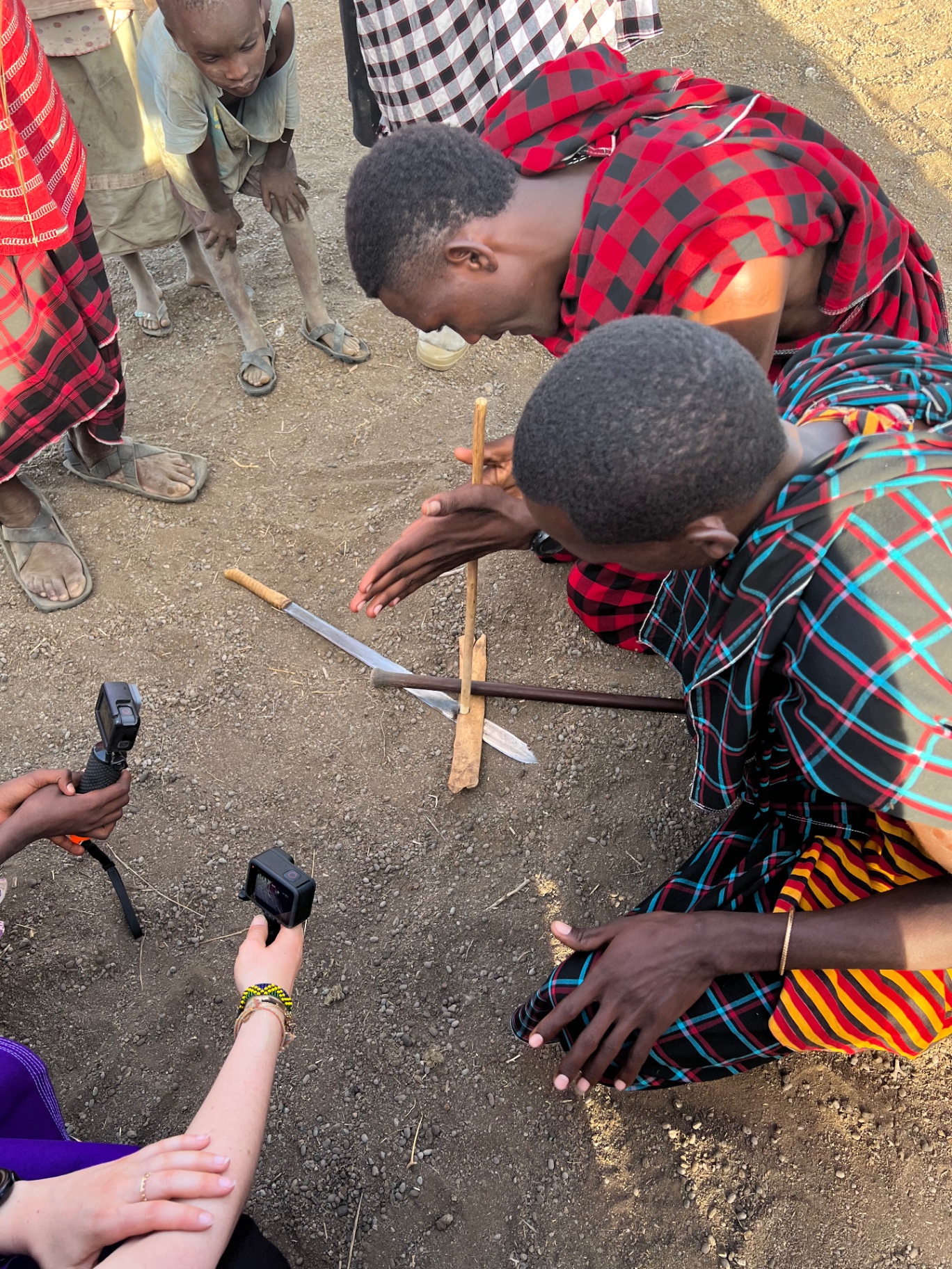 Maasai making fire with sticks